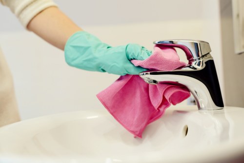Professional office cleaners working in a Bow workplace