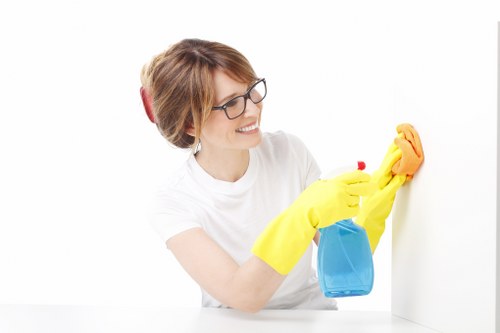Cleaner using protective equipment during routine cleaning